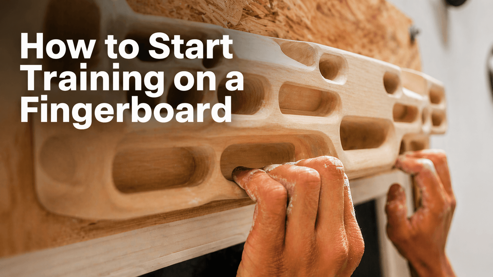 Climber hanging on a wooden fingerboard with controlled half-crimp position during a beginner strength session.